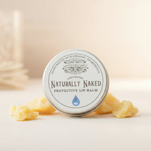 Load image into Gallery viewer, Lip balm container labeled 'Naturally Naked' on a wooden surface with beeswax.