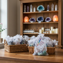 Load image into Gallery viewer, Bag of chakra stones with a label on a counter in a store setting
