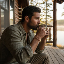Load image into Gallery viewer, man sipping coffee on porch wearing copper cuff
