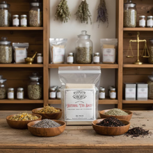 Load image into Gallery viewer, A clear plastic bag containing 50 Natural Tea Bags from Healing Leaf Apothecary, sitting on a wooden countertop in an apothecary setting.
