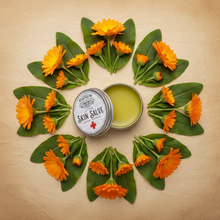 Load image into Gallery viewer, Skin salve jar with a lid and orange flowers and green leaves on a parchment background
