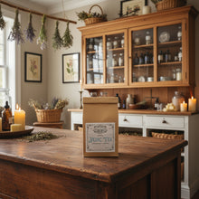 Load image into Gallery viewer, A kraft paper stand-up pouch of Vedic Tea with a white vintage-style label on the front, inn an apothecary setting
